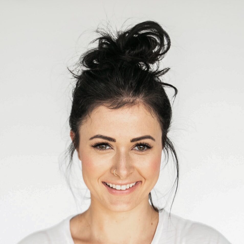 woman in white crew neck shirt smiling