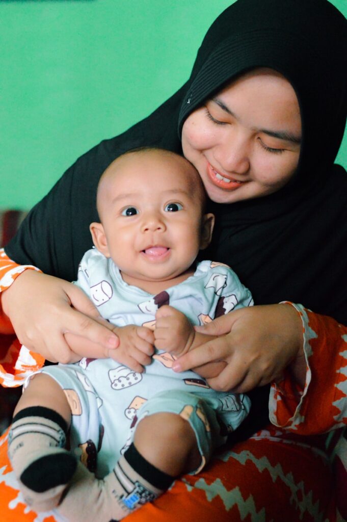 a person holding a baby